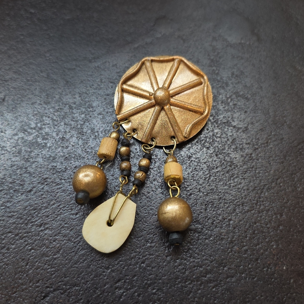 This Vintage Western Boho Wagon Wheel Dangle Brooch